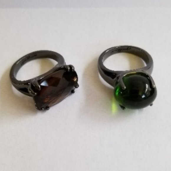 Jewelry Set Of Two Brown And Green Glass Stone Rings On Black Bands